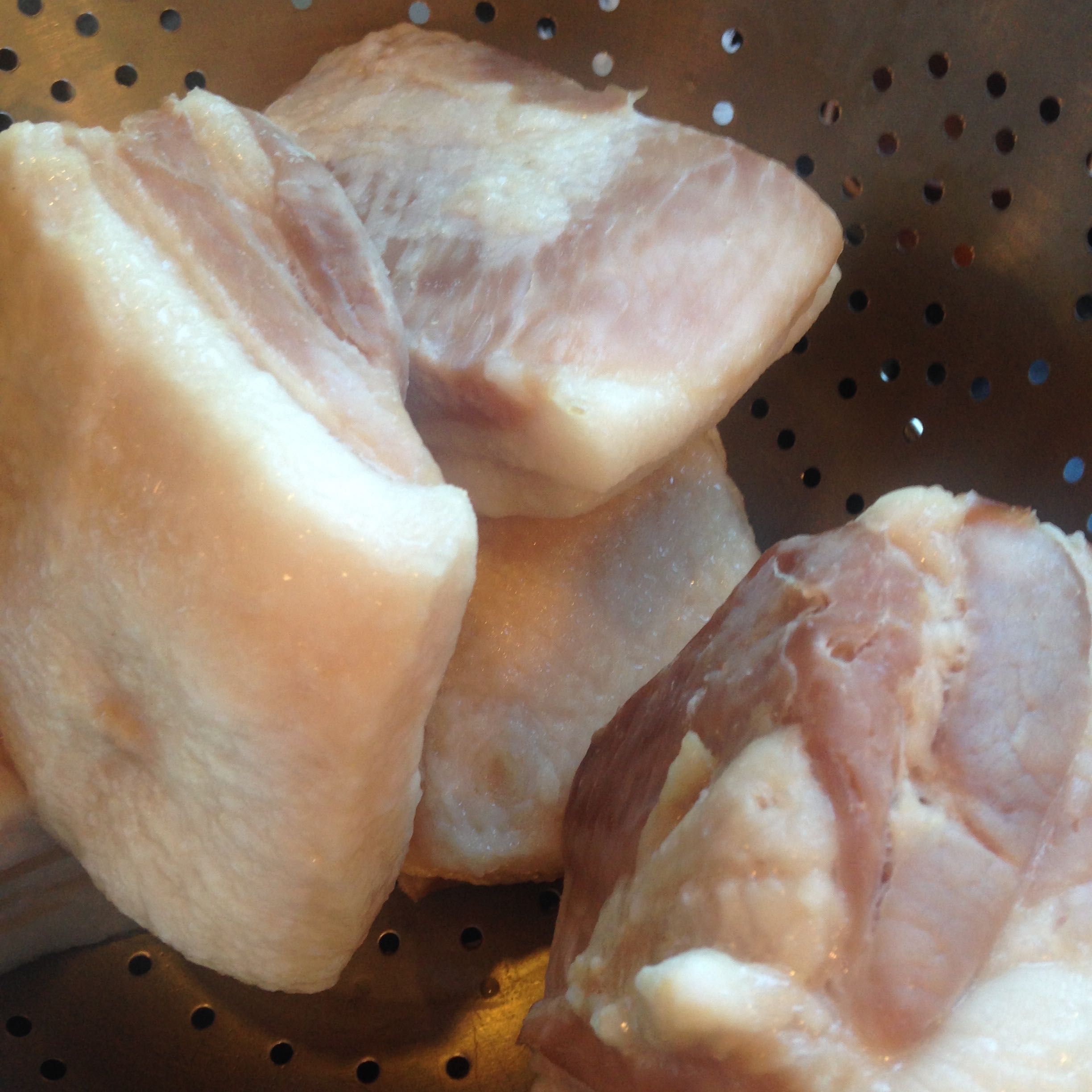 One inch chunks of salt pork are first boiled then drained before adding to the beans.