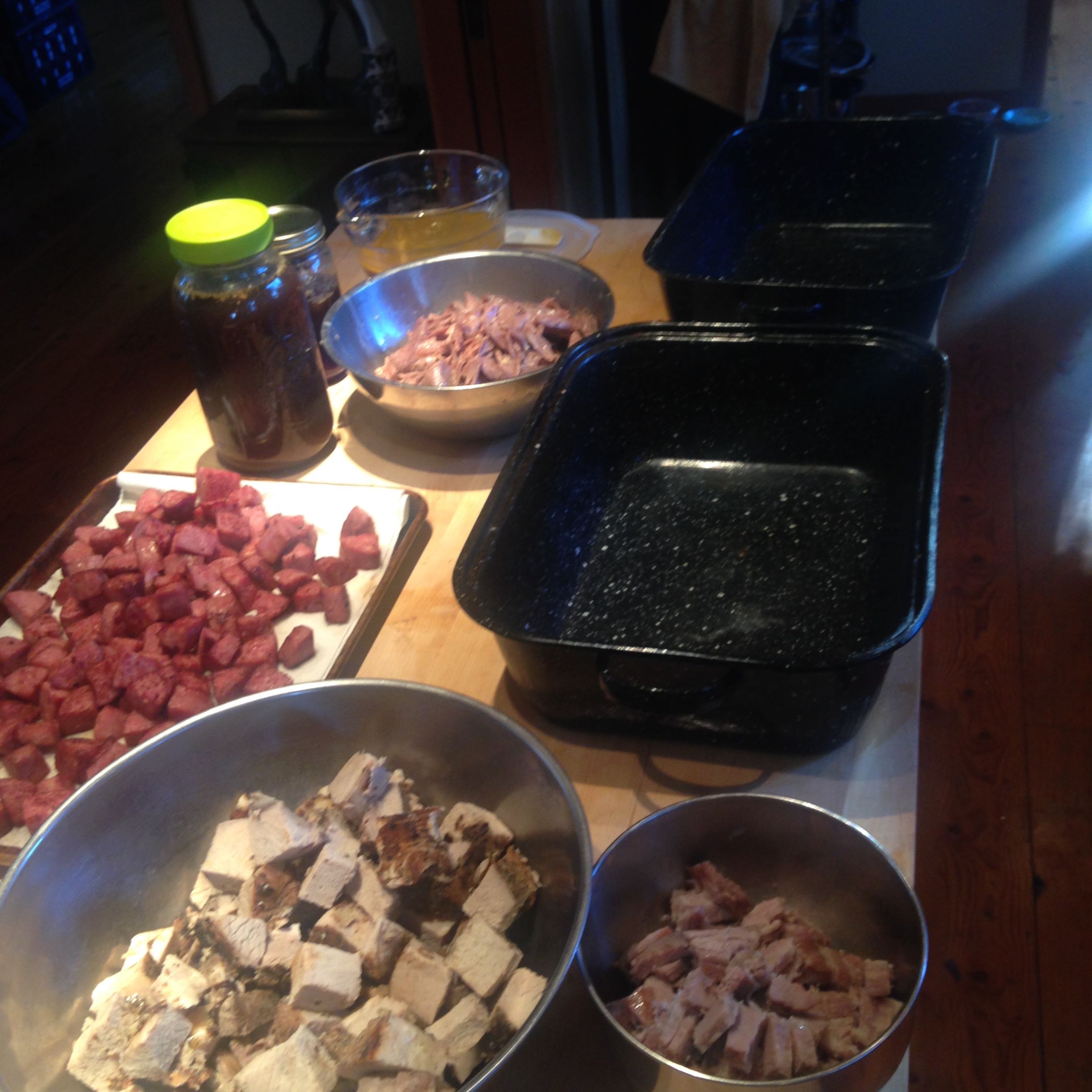 Here you see everything ready to put together, except the beans. They are on the stove. The duck, pork, sausage, juice from the duck and pork,  salt pork are ready to be layered together.